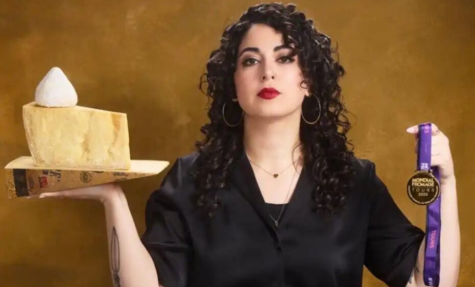 cheesemonger Emilia D'Albero holding 3 pieces of cheese